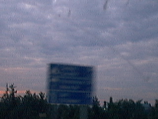 the sign, although you can't read it is advertising parachuting at the next exit